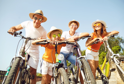 Summer parents family outside biking mother father son daughter exercise