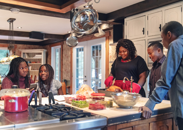 African-American preparing thanksgiving dinner